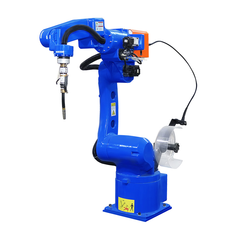 CNC welding robot cell with controller cabinet, welding source and fixtured part